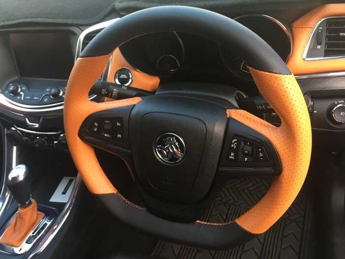 a black and orange steering wheel