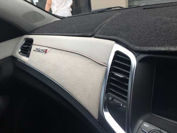 a white and black dashboard cover