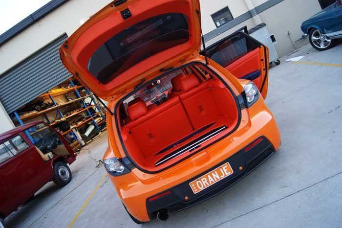 the trunk of an orange car