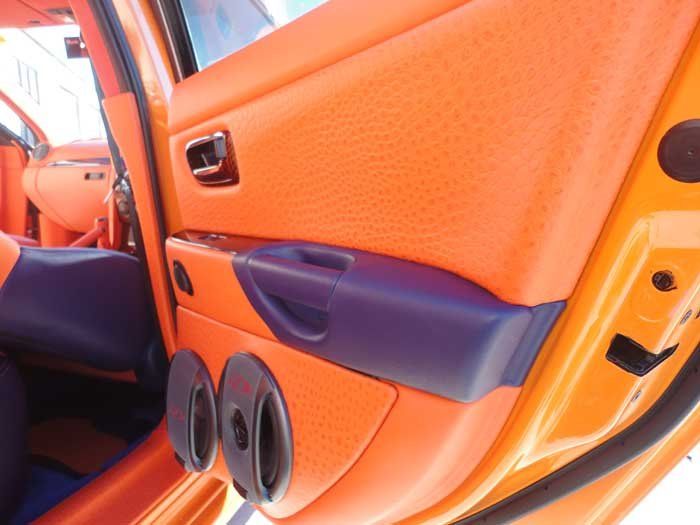 a orange and blue car door with black handles