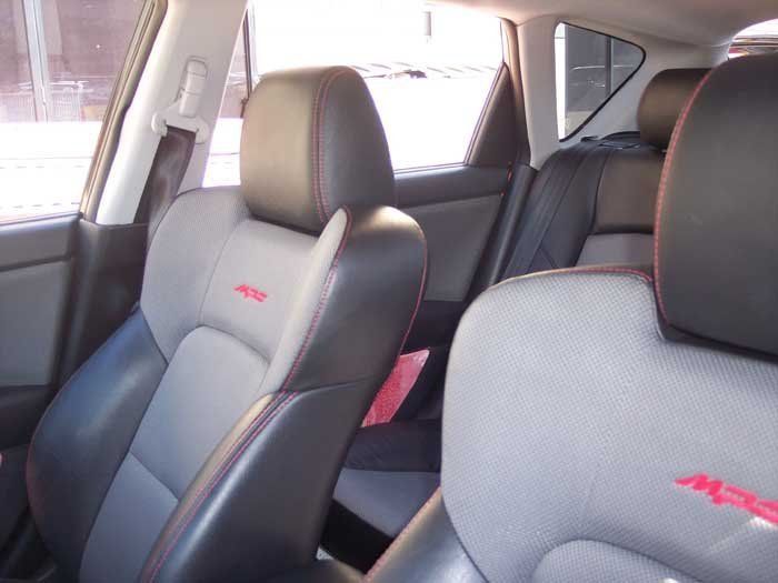 grey seats with red stitches