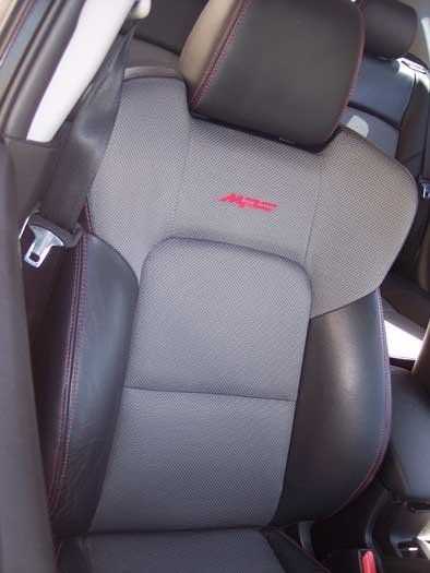grey and black seats with red embellishments
