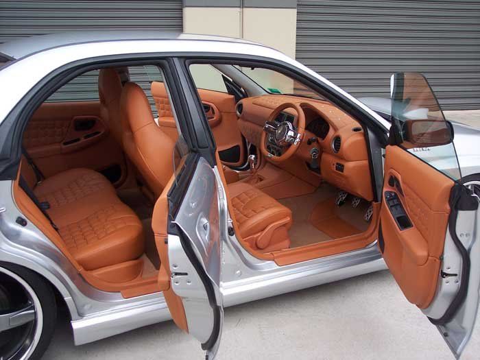 car door open showing tan interior