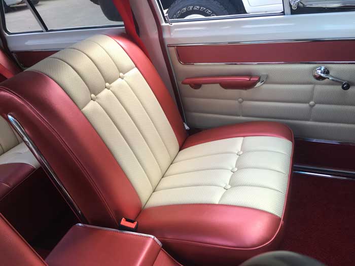 red and cream coloured car seat