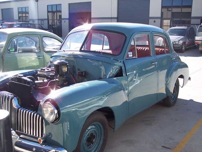 old blue car with the hood up