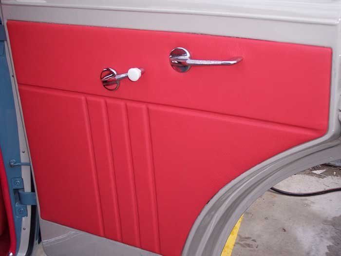 a door with red interior and a silver door handle