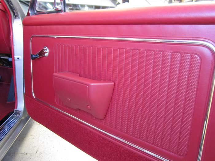 a red interior of a car door