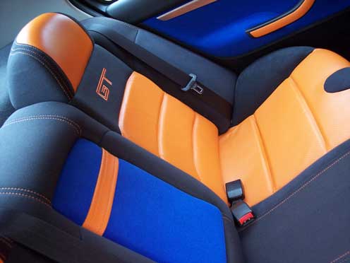 orange and blue and black car seat