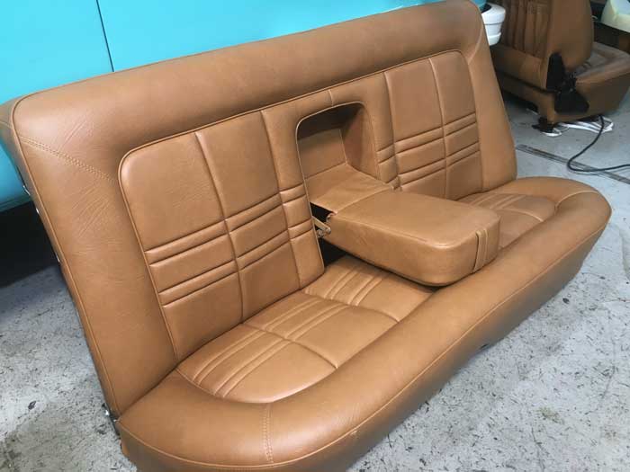 brown car seat with arm rest