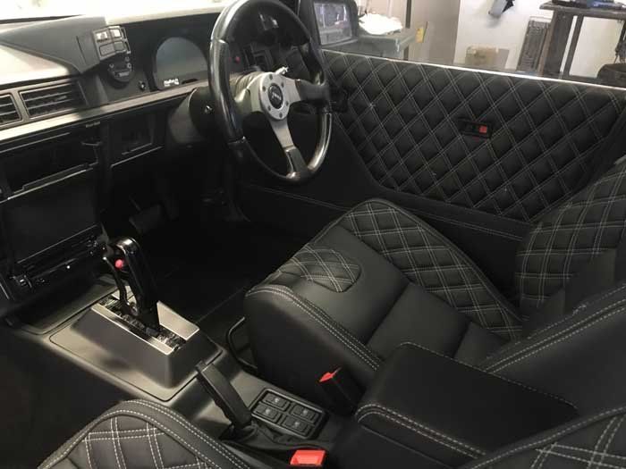 black steering wheel and driver seat