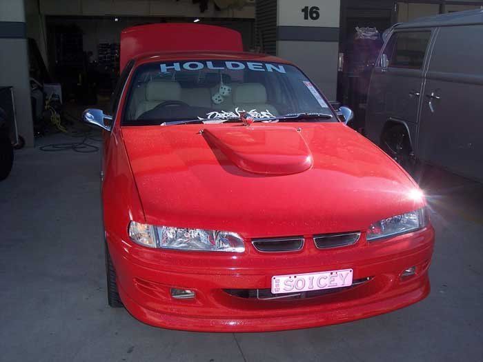 a red car with holden letters