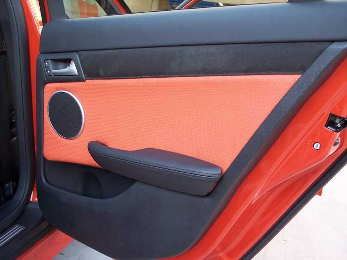 orange and black door with a black speaker