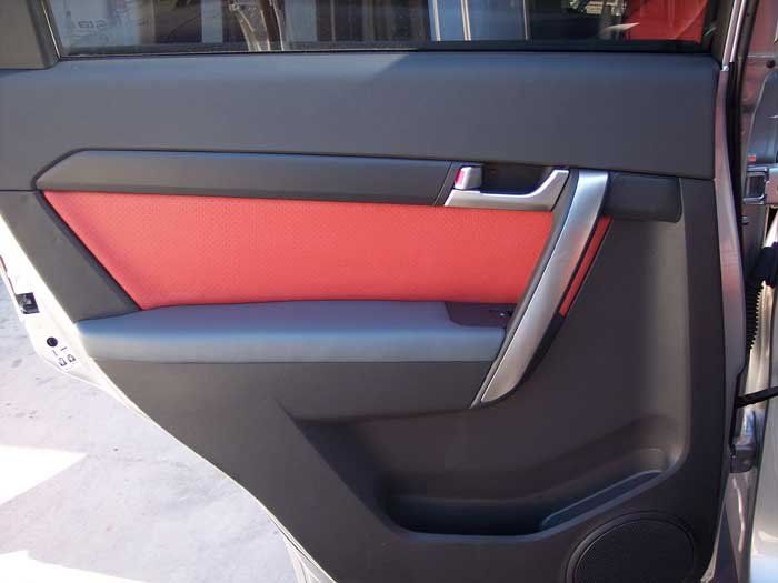 black and red car door with a silver handle