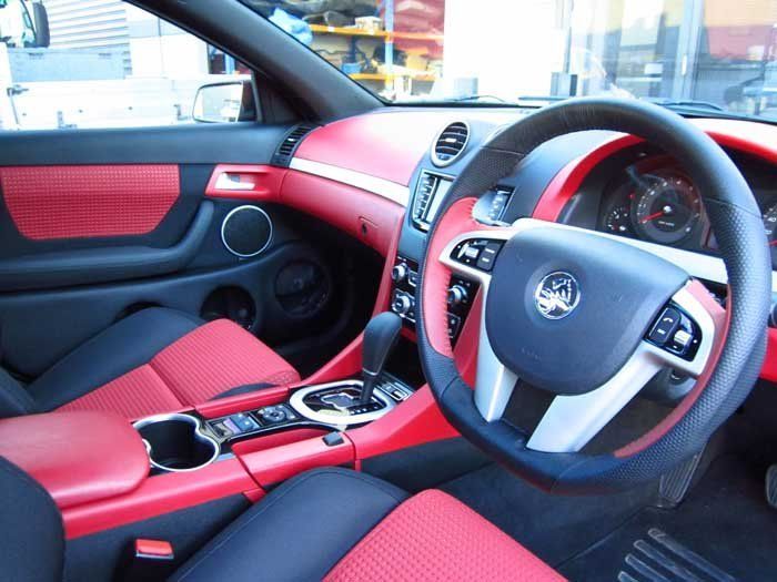 black steering wheel and red dashboard