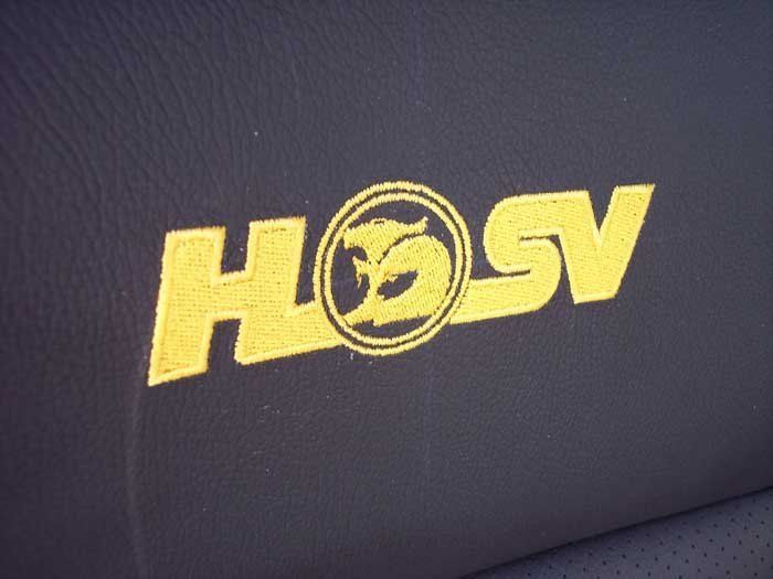 yellow hosv logo on an black background