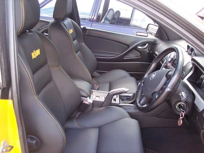 front seat with yellow embellishments