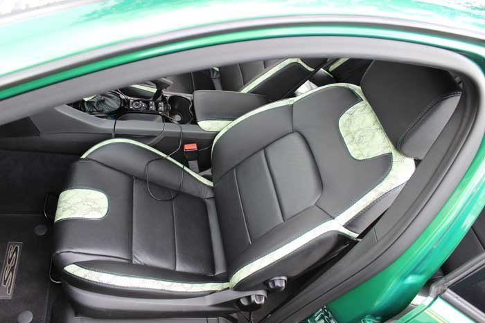 black seats inside of a green car