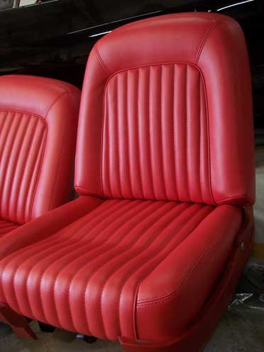 red car seat with striped padding