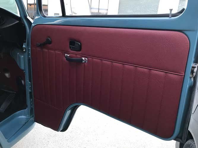 newly upholstered red car door interior