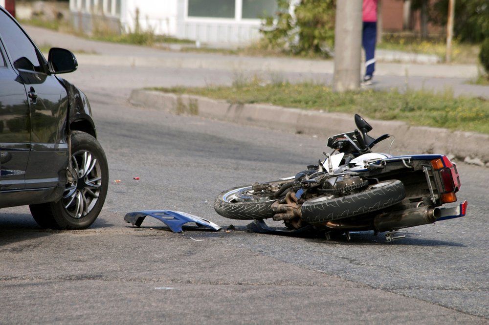 motorcycle on ground after a bike accident