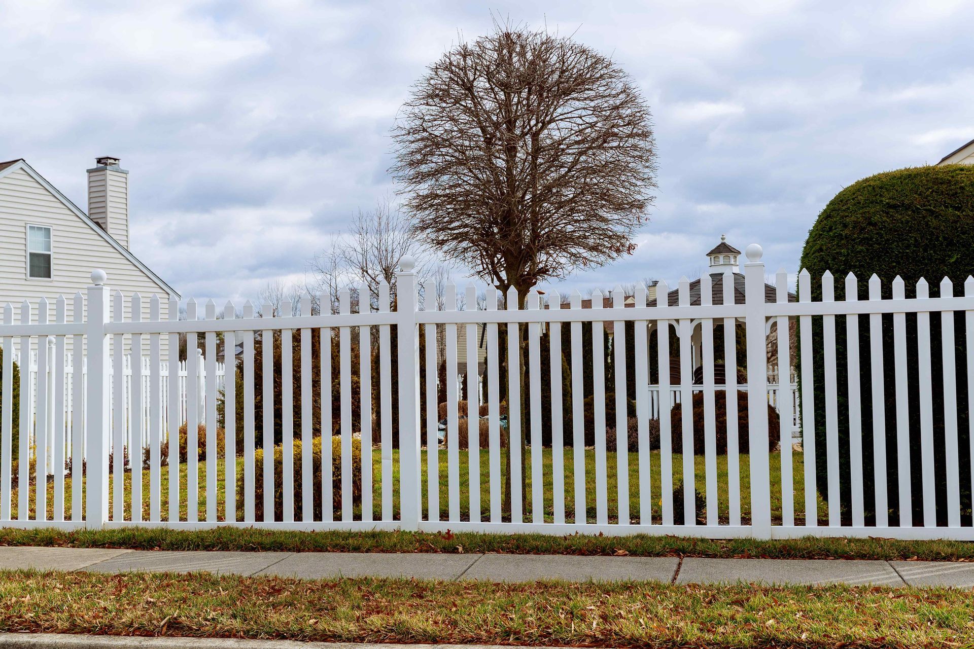 Decorative white wood picket fence