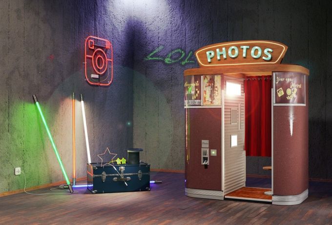 A photo booth in a room with a sign that says photos