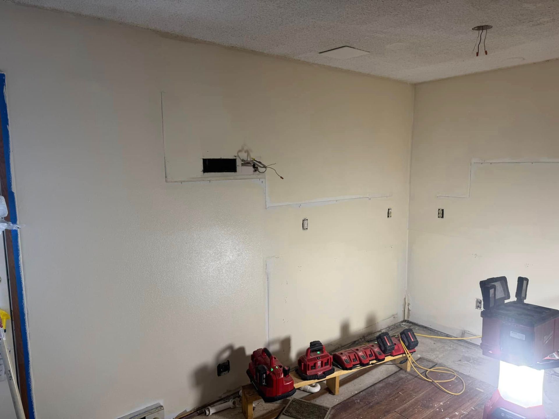 A room that is being remodeled with a lot of tools on the floor.