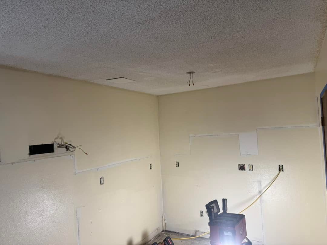 There is a vacuum cleaner in the middle of the room.