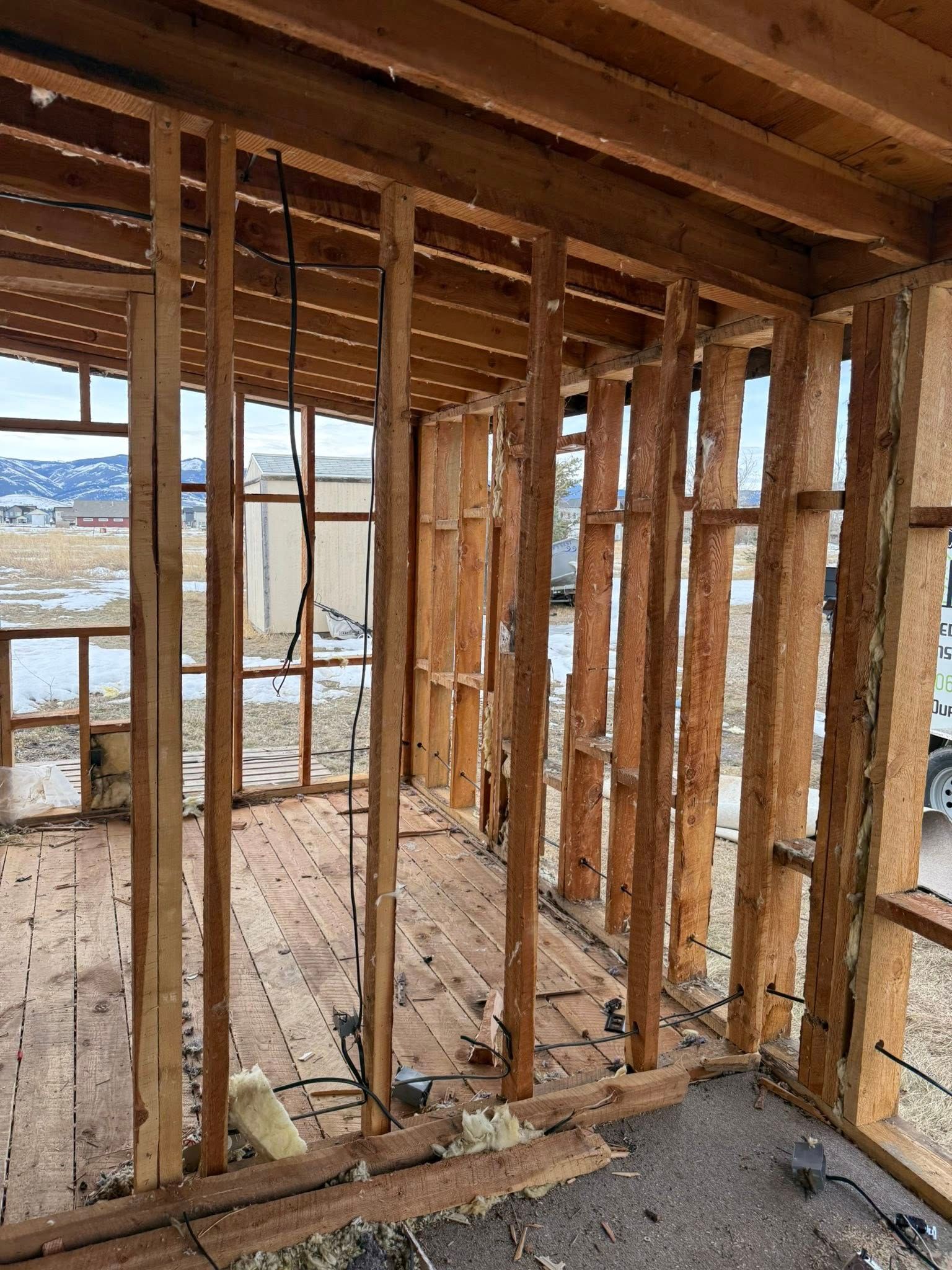 A wooden frame of a house under construction.