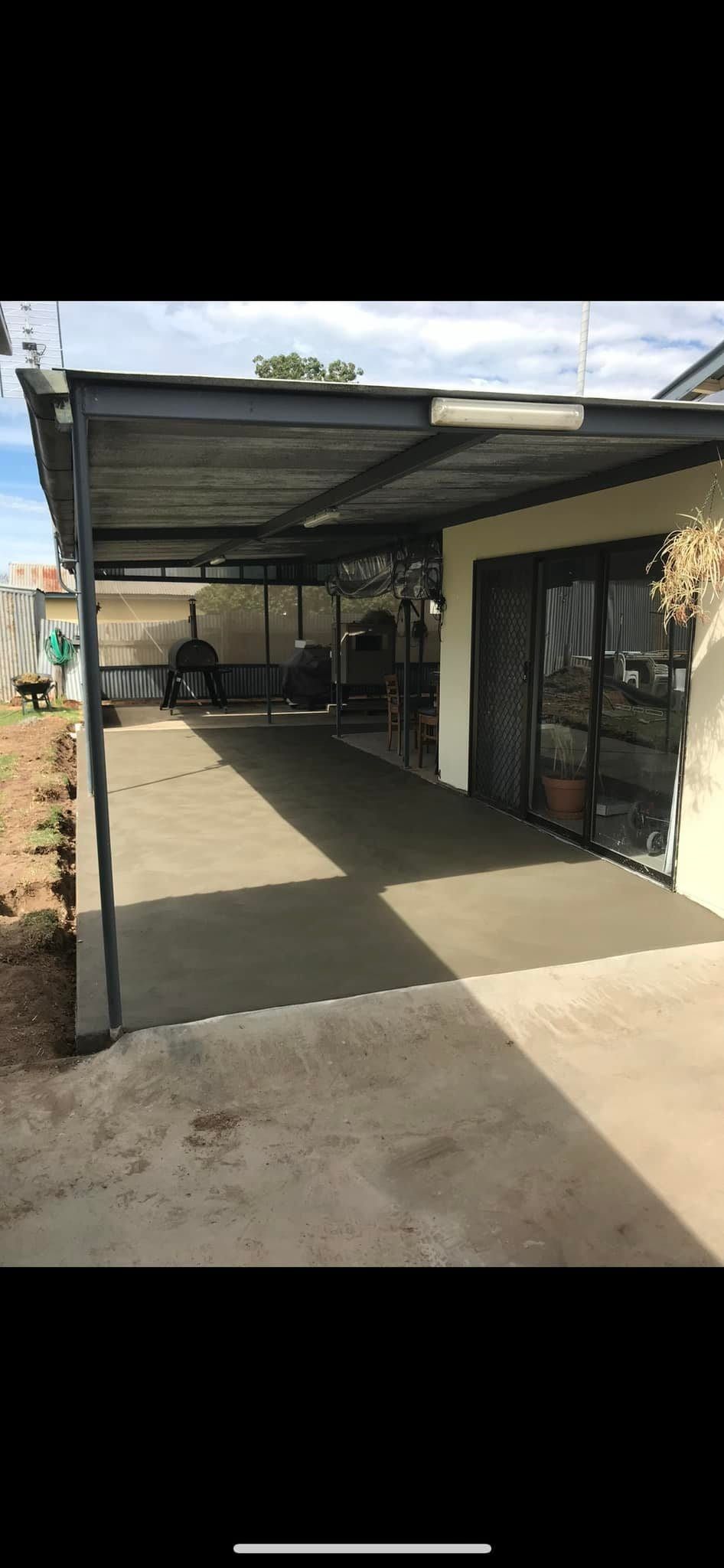A Driveway With a Canopy Over It and a House in the Background — Brycey's Concreting In Frederickton, NSW