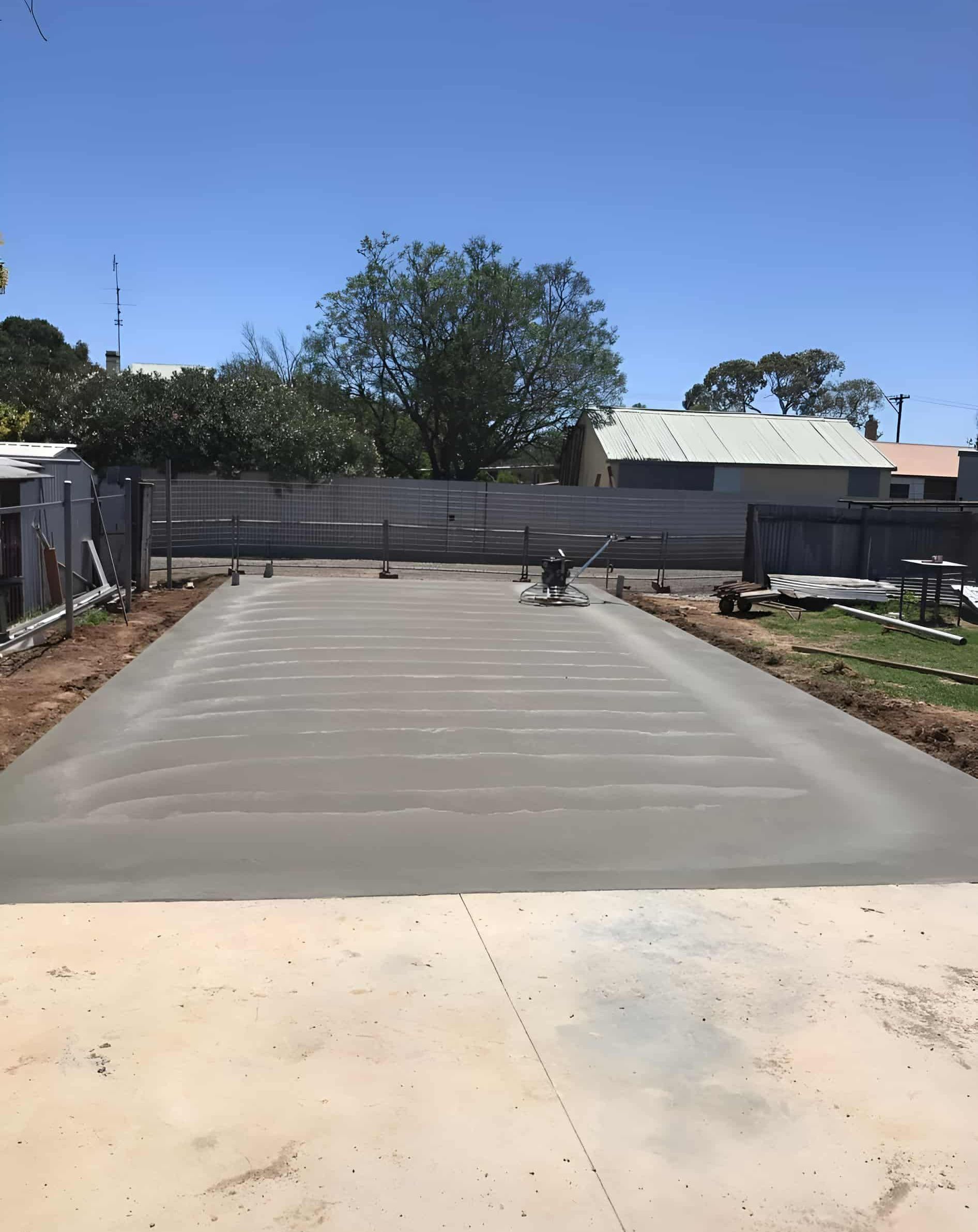 A Concrete Driveway is Being Built in the Backyard of a House — Brycey's Concreting In Frederickton, NSW