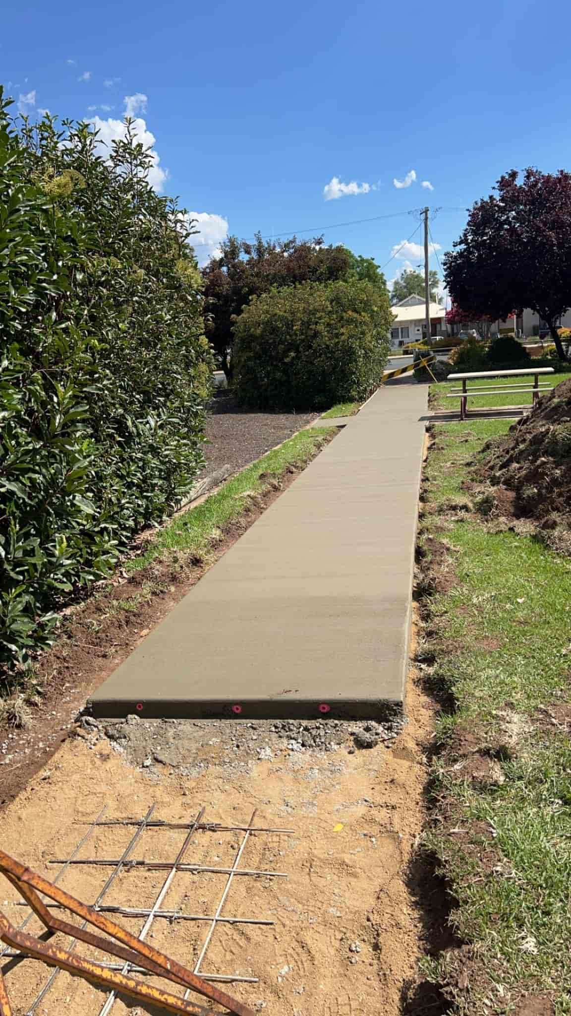 A Concrete Walkway is Being Built in a Yard — Brycey's Concreting In Frederickton, NSW