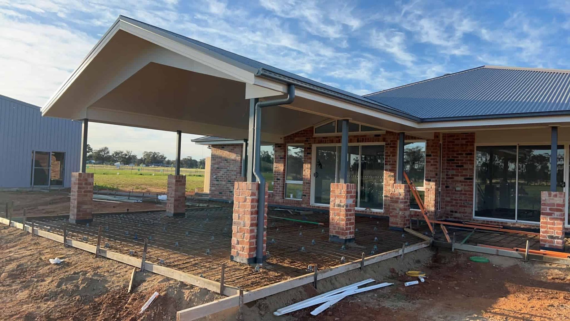 A House is Being Built in the Middle of a Dirt Field — Brycey's Concreting In Frederickton, NSW