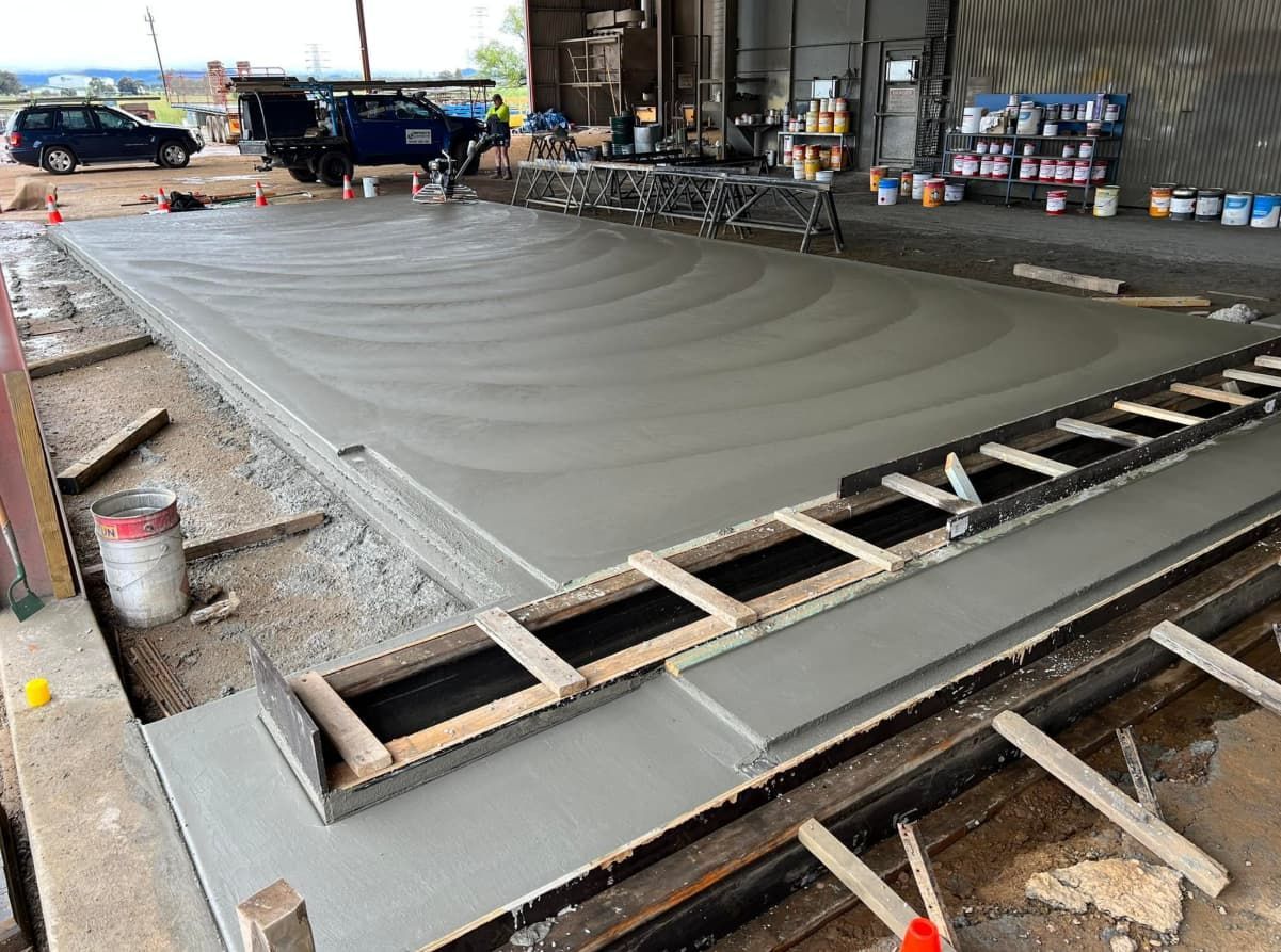 A Concrete Floor is Being Built in a Garage — Brycey's Concreting In Frederickton, NSW