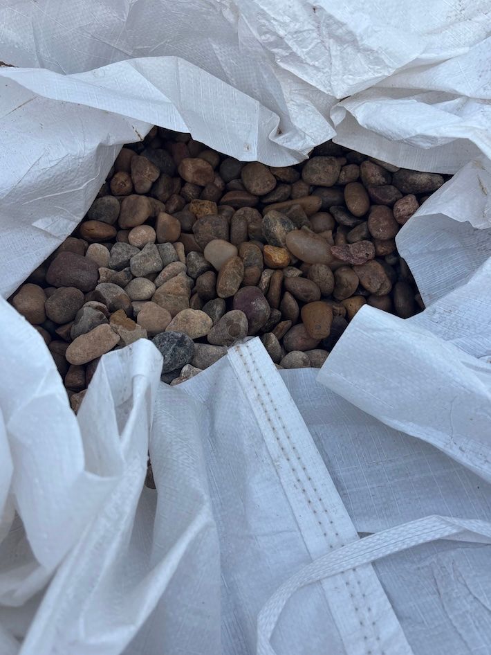 Rainbow river rock in bag