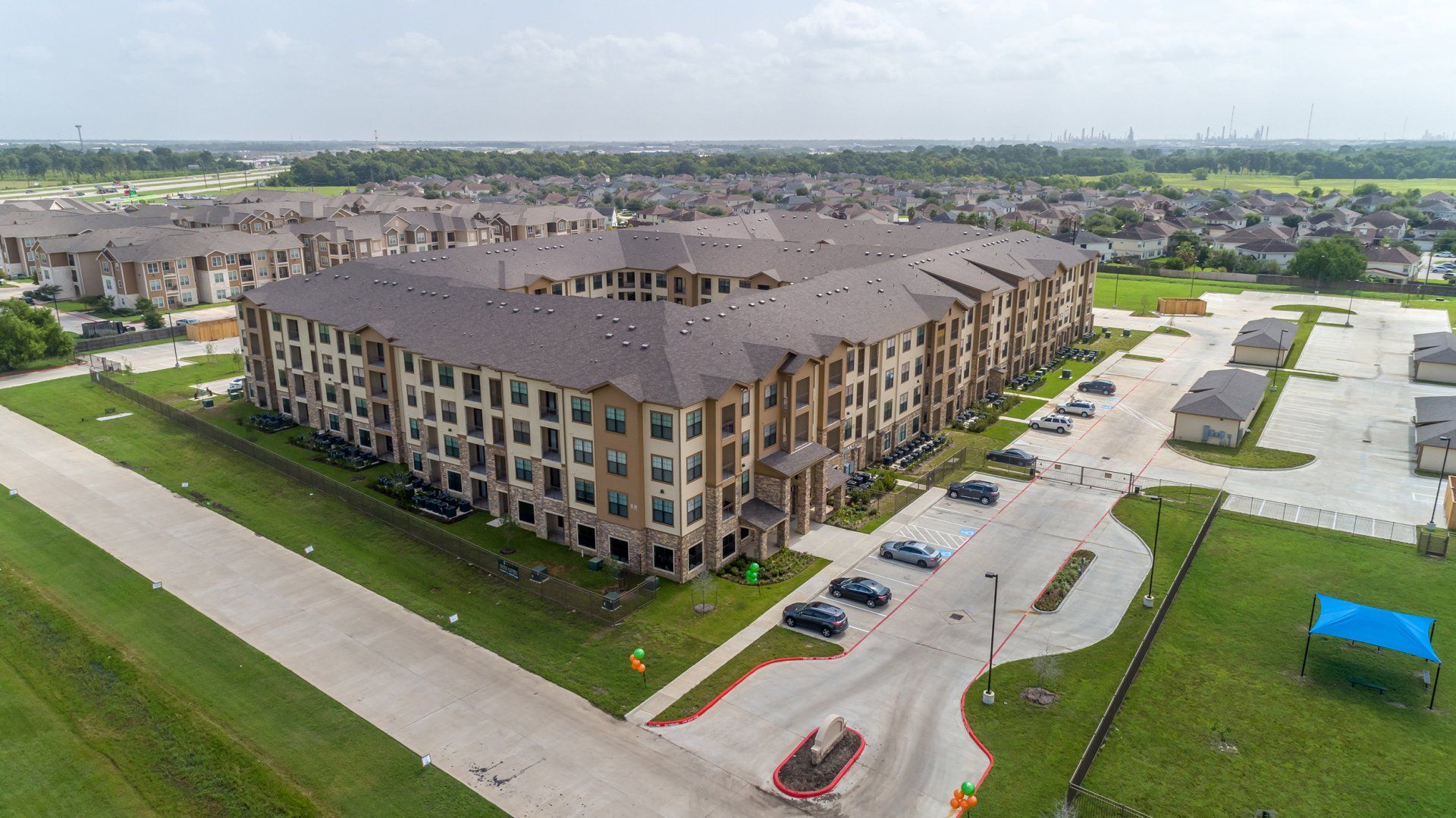 Haven at Liberty Hills | Drone View of Apartment Building and Street