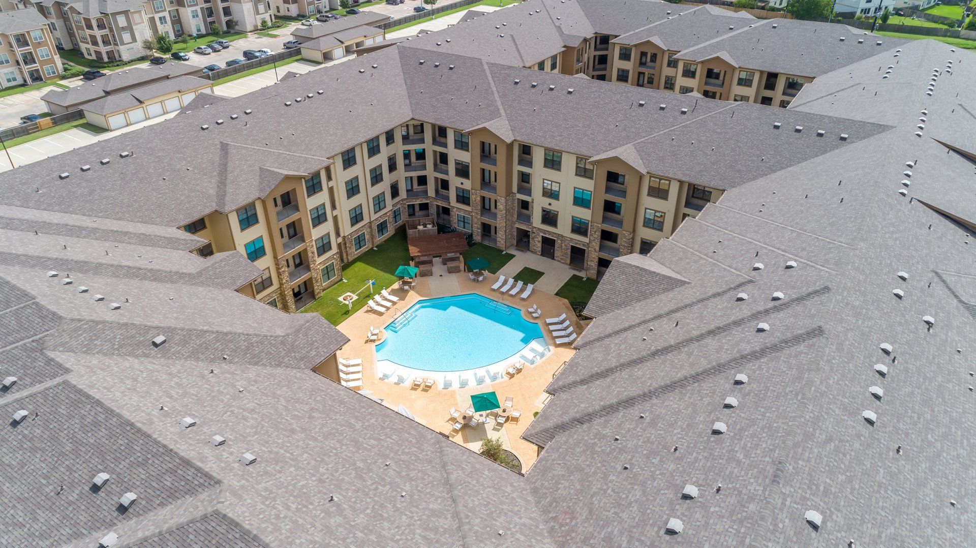 Haven at Liberty Hills | Drone View of Apartment Building with Pool