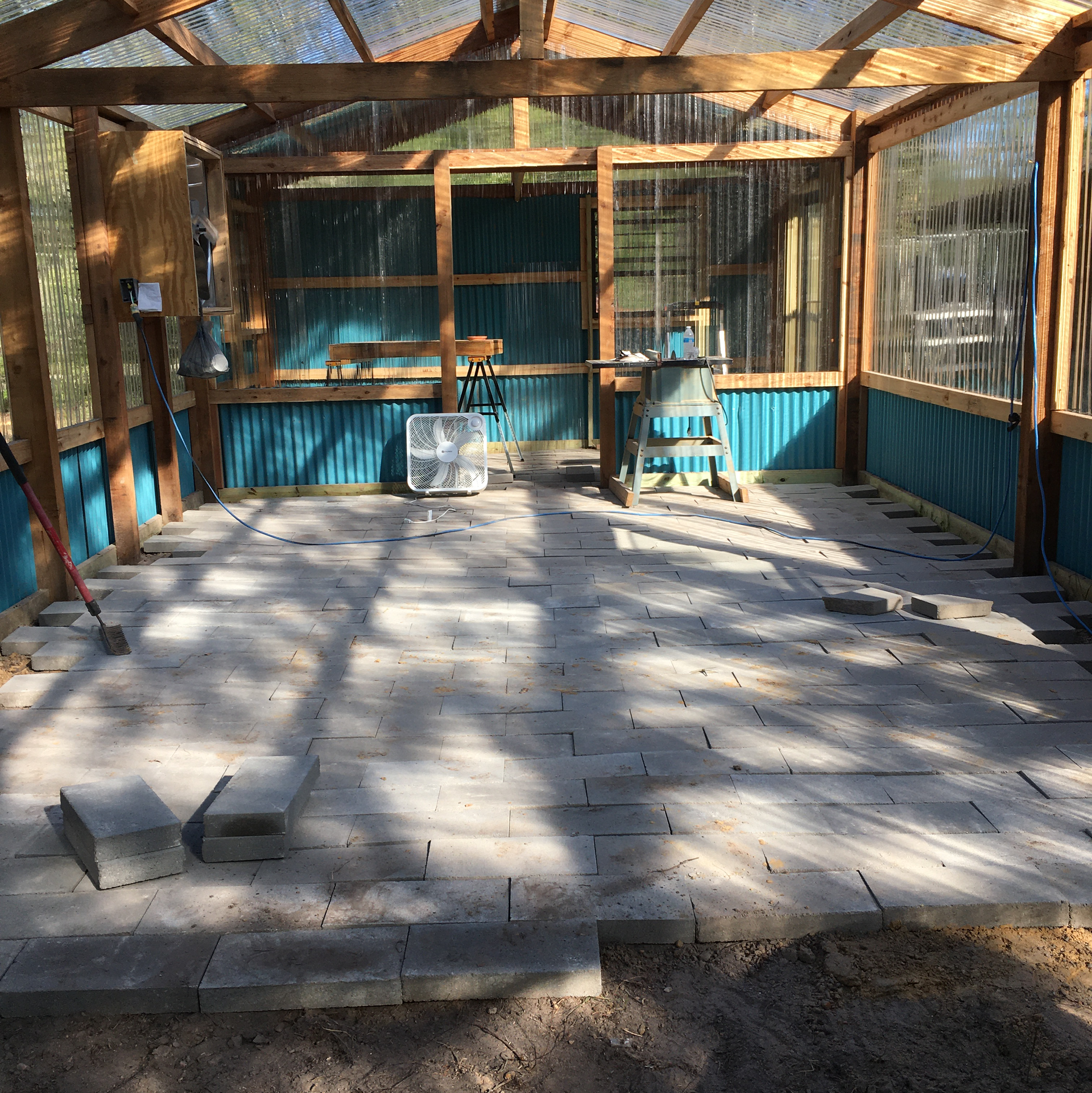 A greenhouse with a bell hanging from the ceiling