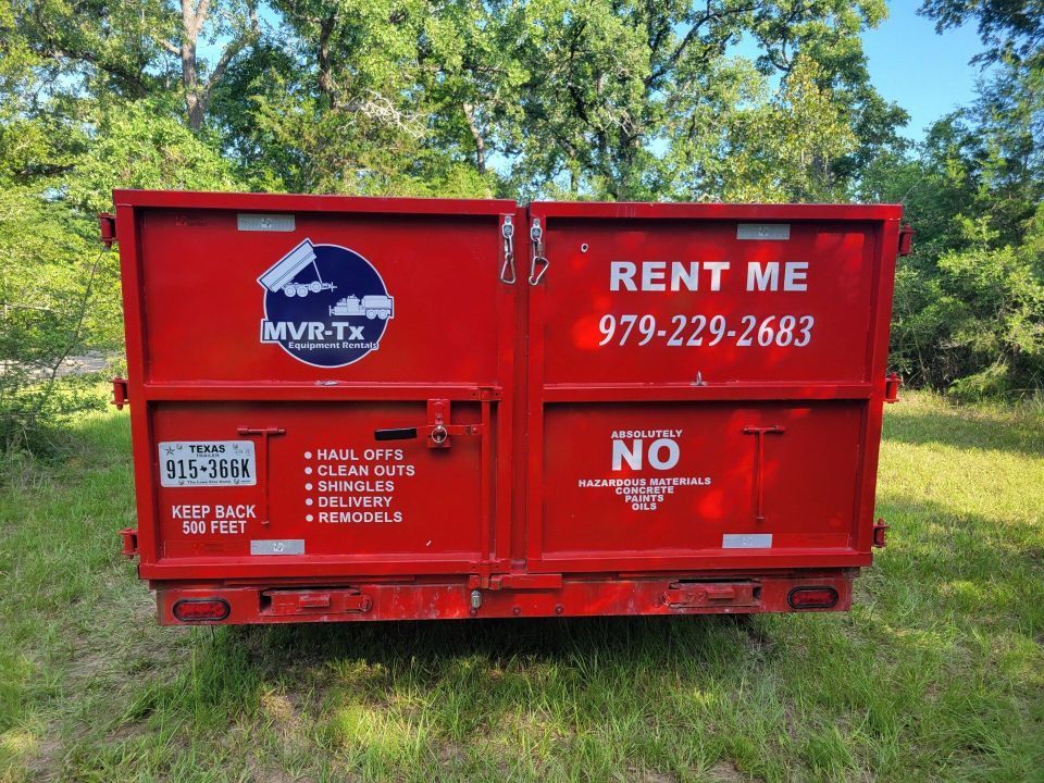 A red dumpster that says rent me on it