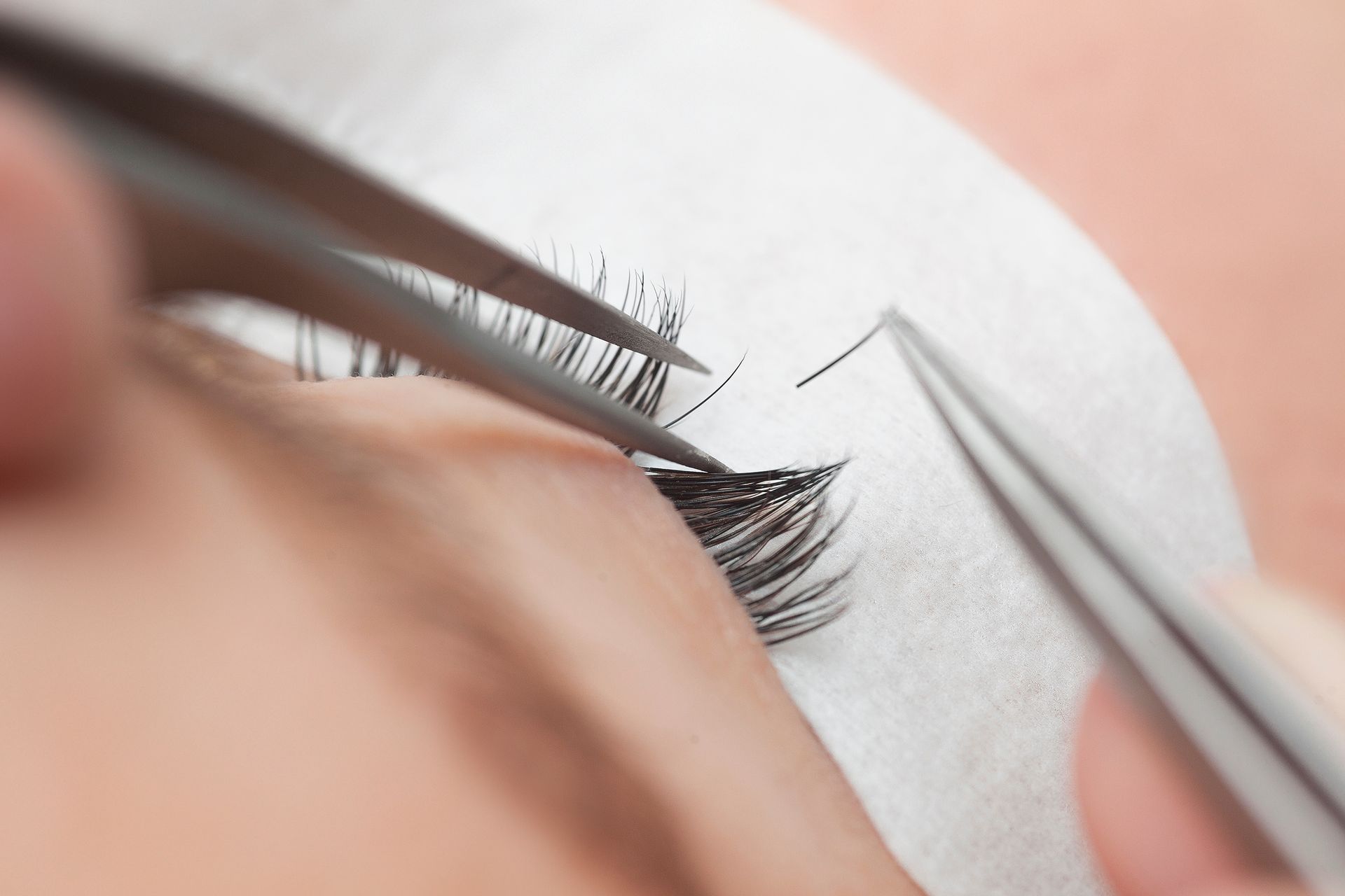 applying single strands of eyelash extension