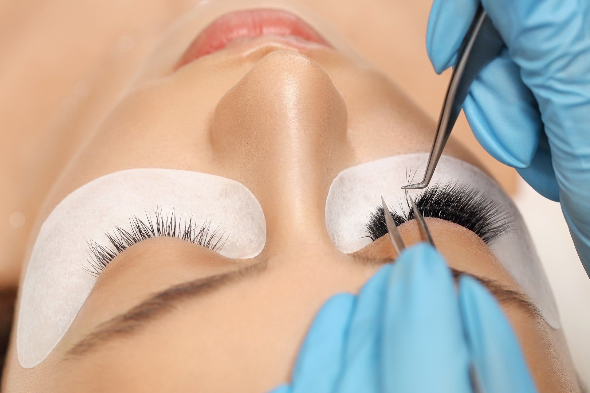 a woman getting Russian volume lashes