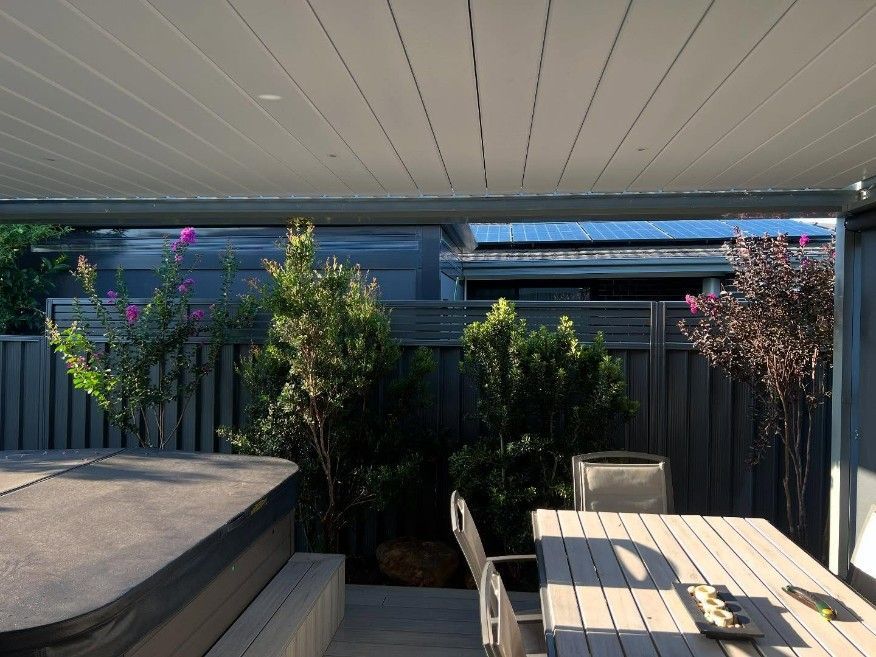 A Patio With a Table and Chairs and a Hot Tub — JOA - Construction & Maintenance in Appin, NSW