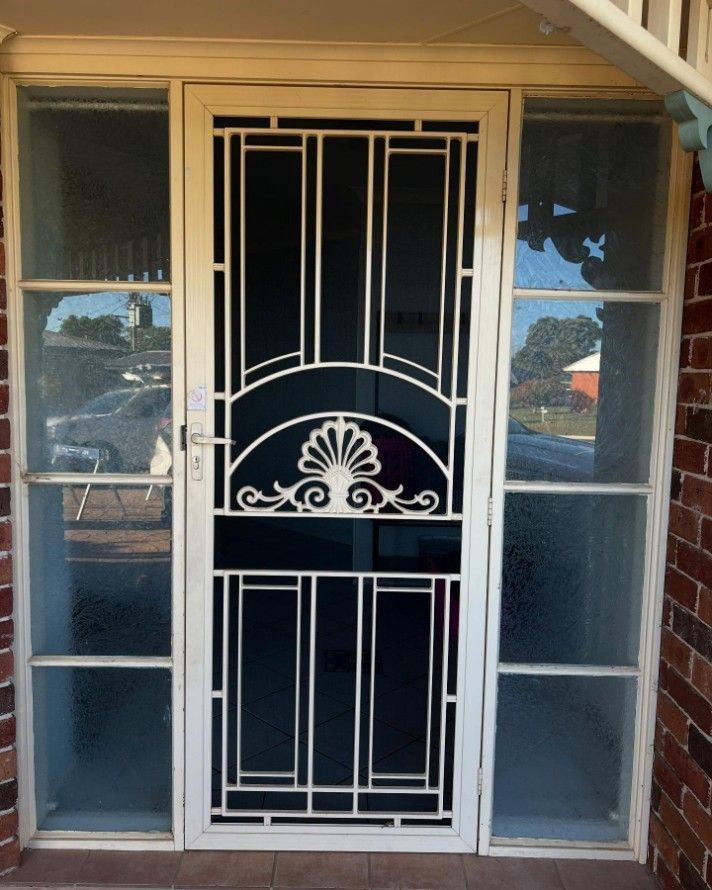 A White Door With a Fancy Design on It — JOA - Construction & Maintenance in Wollongong, NSW