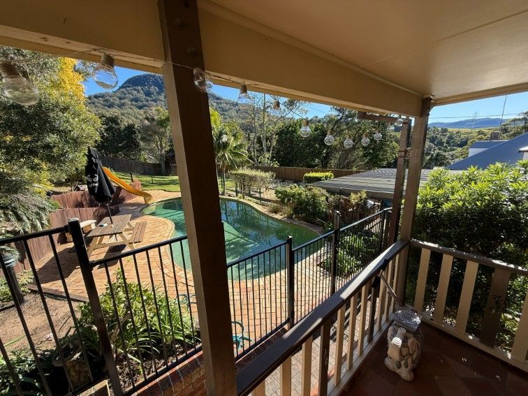 A View of a Swimming Pool From a Balcony — JOA - Construction & Maintenance in Appin, NSW