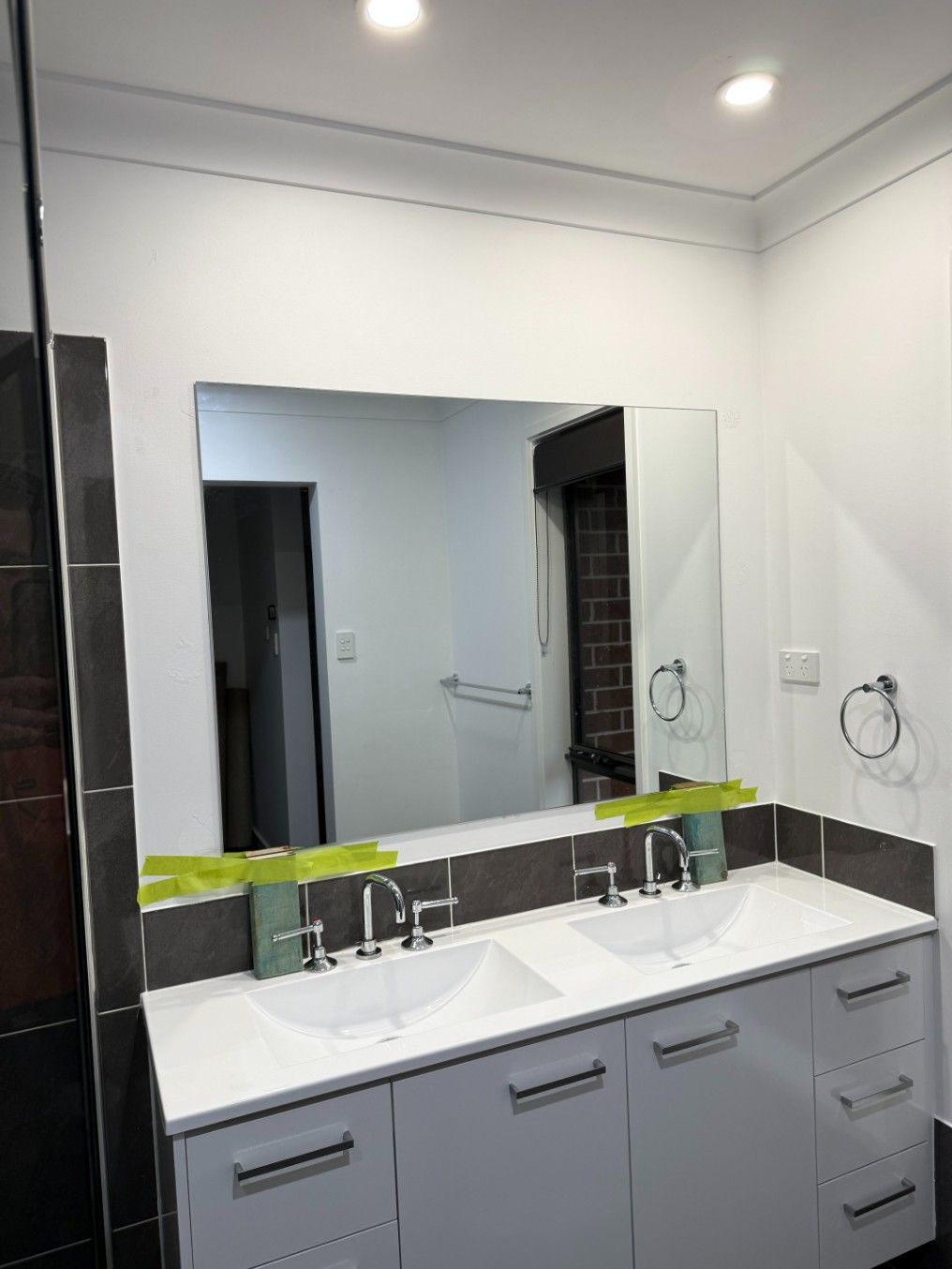 A Bathroom With Two Sinks and a Large Mirror — JOA - Construction & Maintenance in Appin, NSW