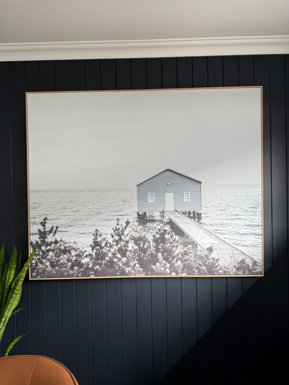 A Black and White Photo of a House on a Dock in the Ocean — JOA - Construction & Maintenance in Appin, NSW
