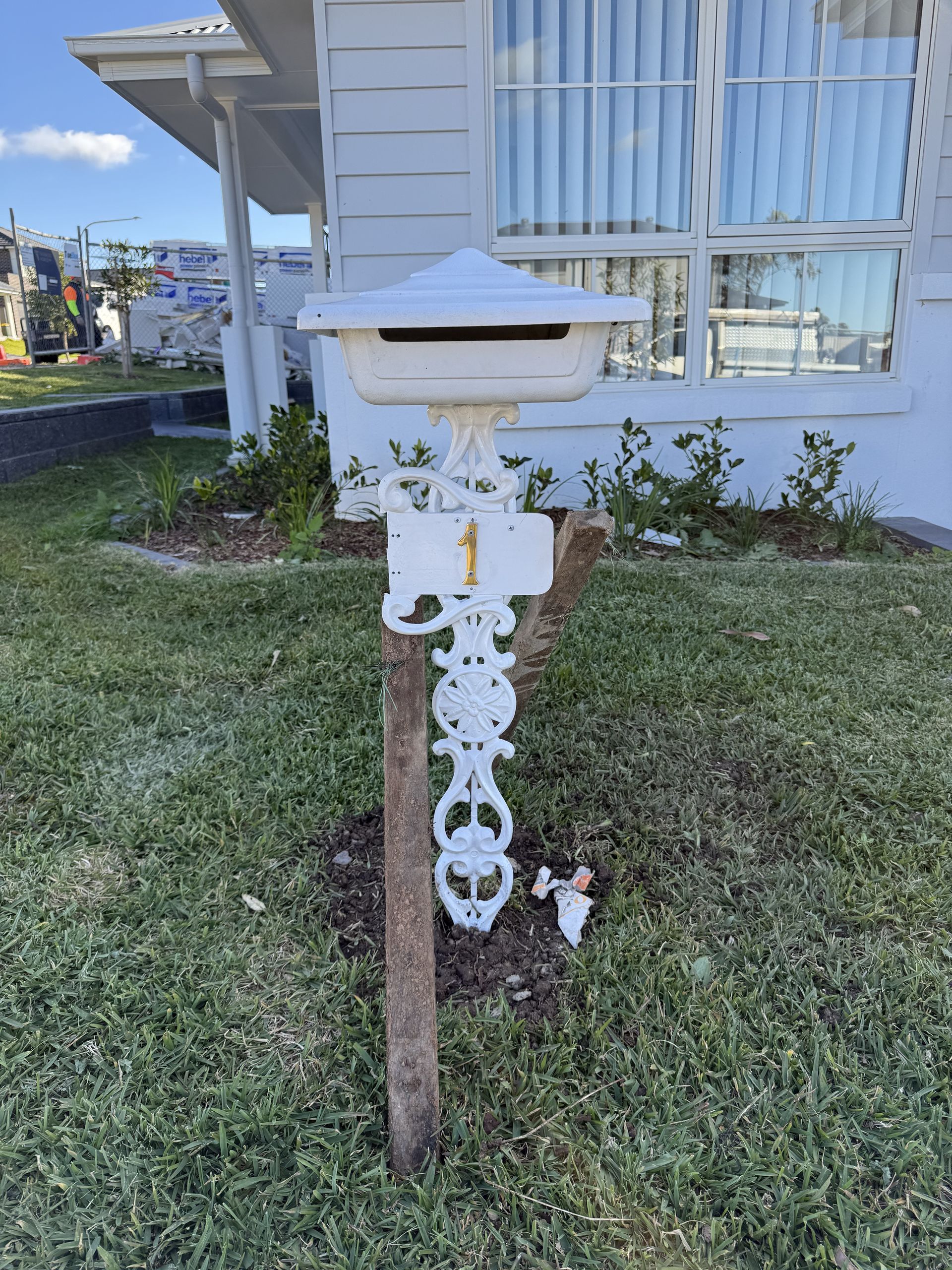 A Close Up of a white mailbox with the number 1 on it — JOA - Construction & Maintenance in Wollongong, NSW