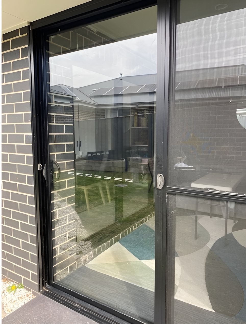 There is a Balcony With a Railing in Front of a Building — Canobolas Glass Service In Orange, NSW