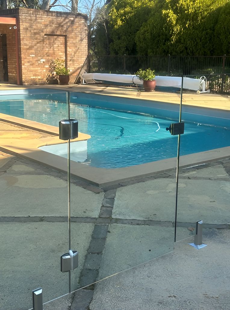 Swimming Pool With Glass Fence Around It — Canobolas Glass Service In Orange, NSW