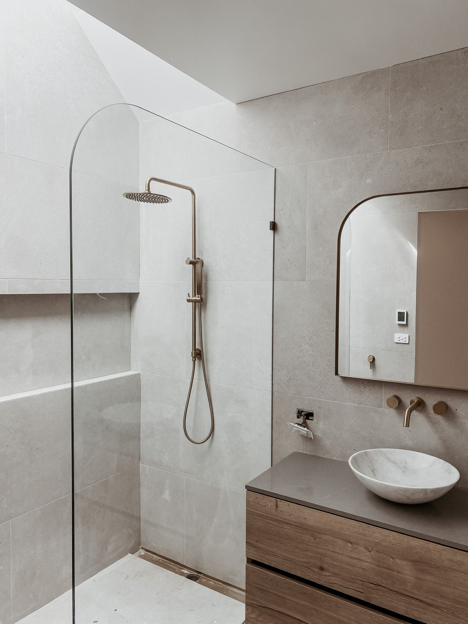 A Bathroom With a Walk in Shower , Sink and Mirror — Canobolas Glass Service In Orange, NSW
